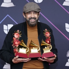 Juan Luis Guerra poses in the press room with the award for best traditional pop vocal album, best tropical song and best arrangement at the 22nd annual Latin Grammy Awards on Thursday, Nov. 18, 2021, at the MGM Grand Garden Arena in Las Vegas. (Photo by Eric Jamison/Invision/AP)  (Eric Jamison / Eric Jamison/invision/ap)  Facebook Twitter